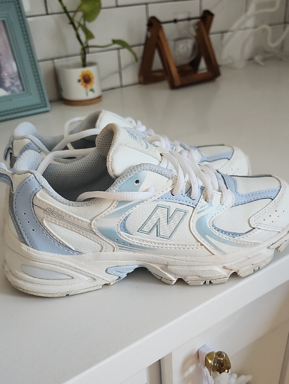 New Balance Kids White and Light Blue Athletic Sneakers